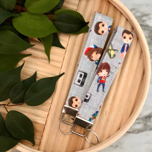 Stranger Things Cartoon Cast Print Fabric Wristlet Keychain, Key Fob