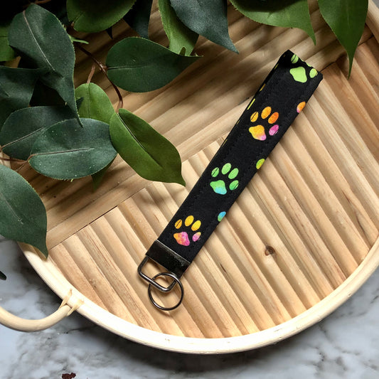 Pastel Tie Dye Paw Prints on Black Fabric Wristlet Keychain, Key Fob